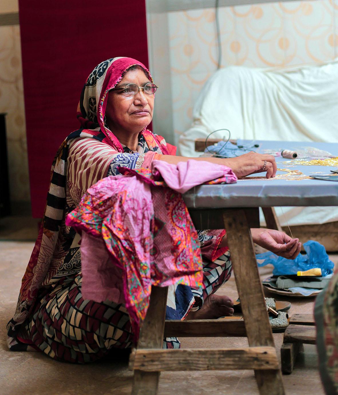 Woman at work sewing material